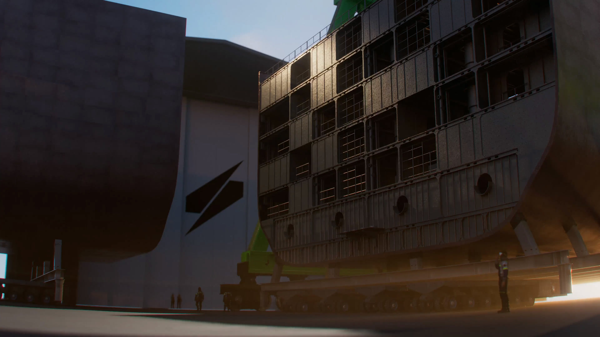 Rendering of a hull block moving between Port Alpha assembly halls on a transporter